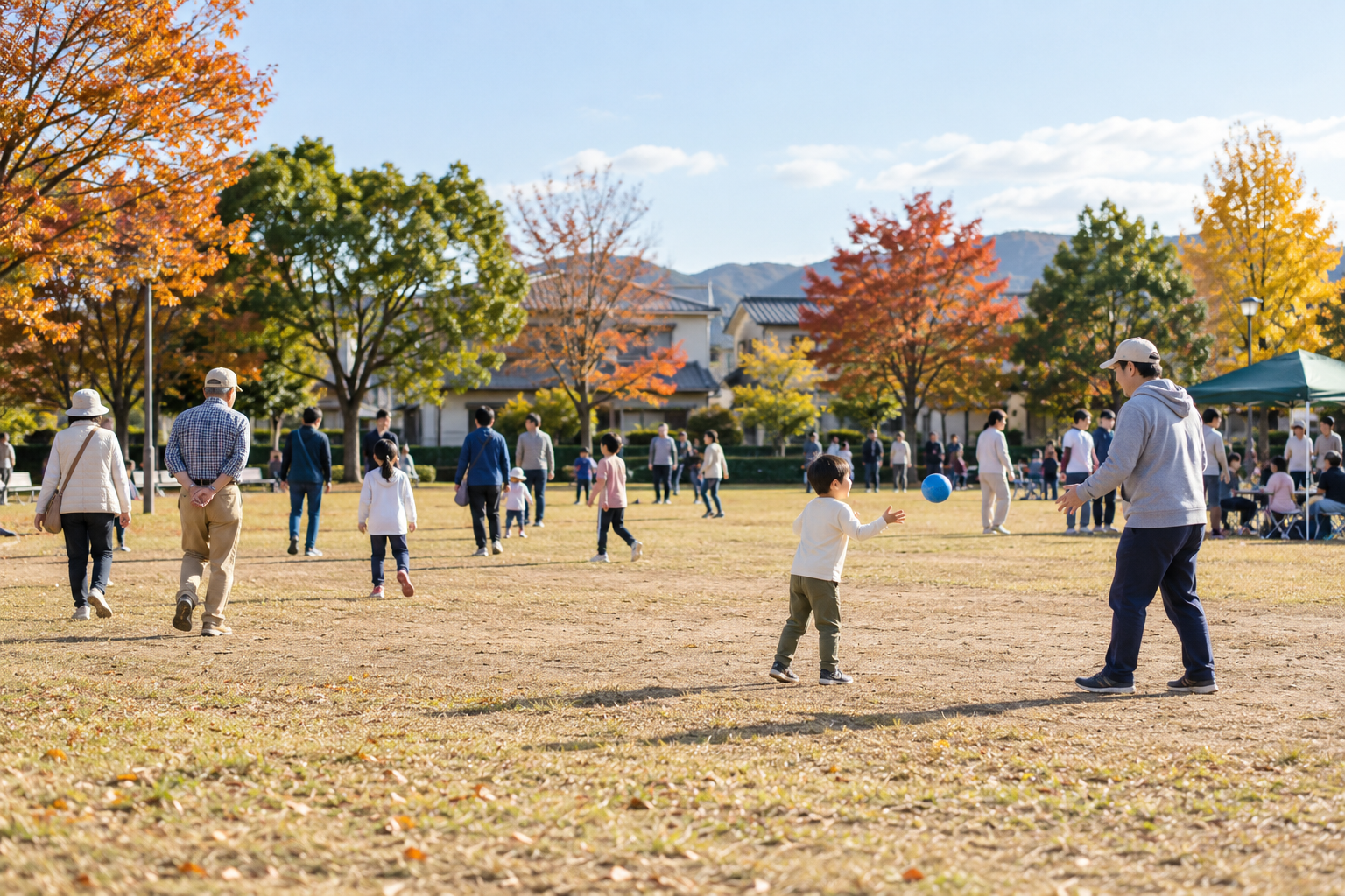 秋の地域公園で思い思いに過ごす人々